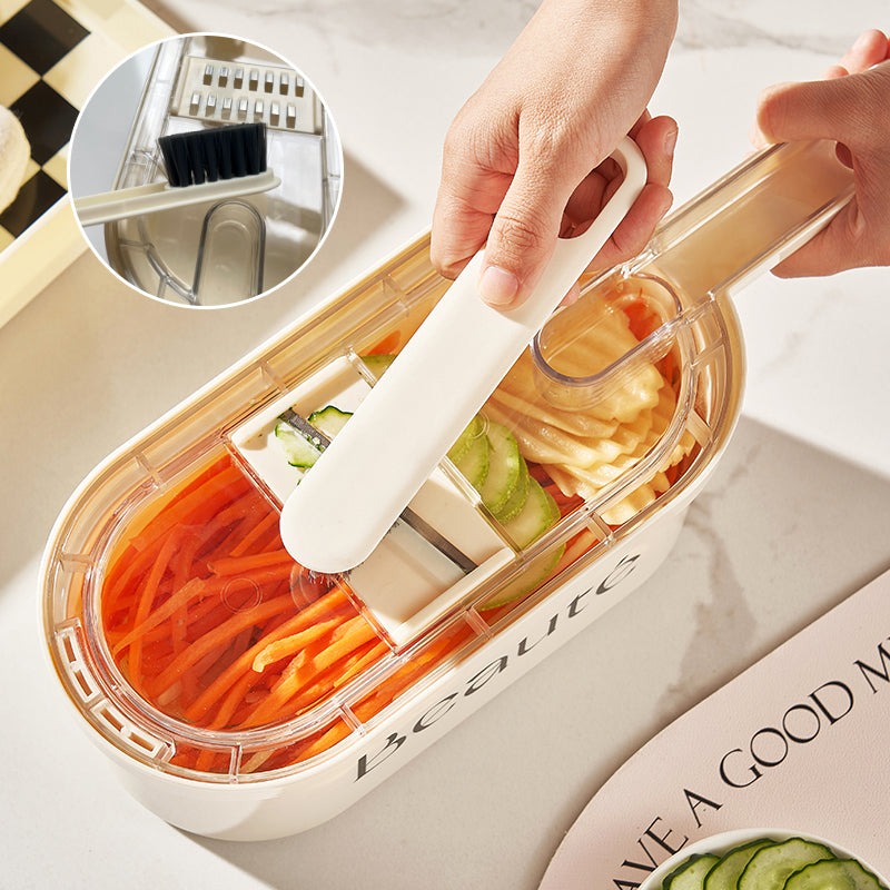 Vegetable slicer with built-in food container and cleaning brush