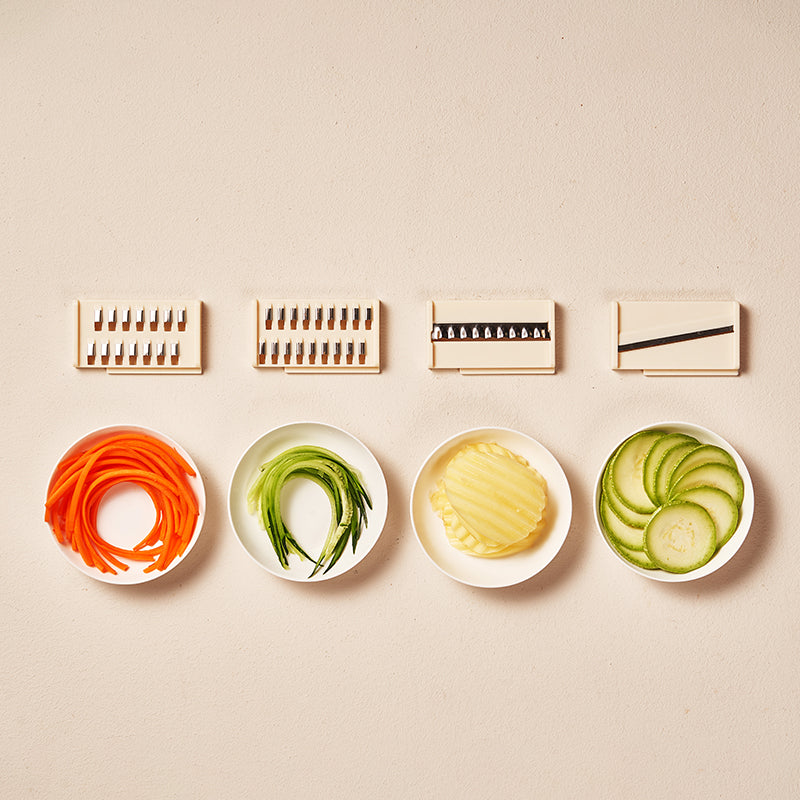 Modern kitchen vegetable cutter with easy-clean design and brush