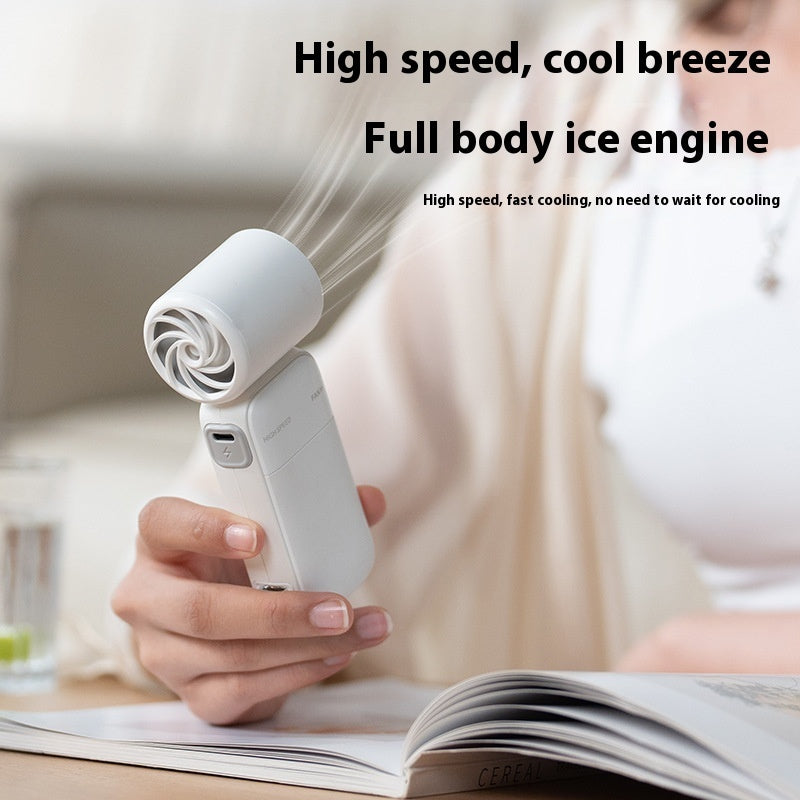 Compact handheld turbo fan with adjustable airflow for travel and office use