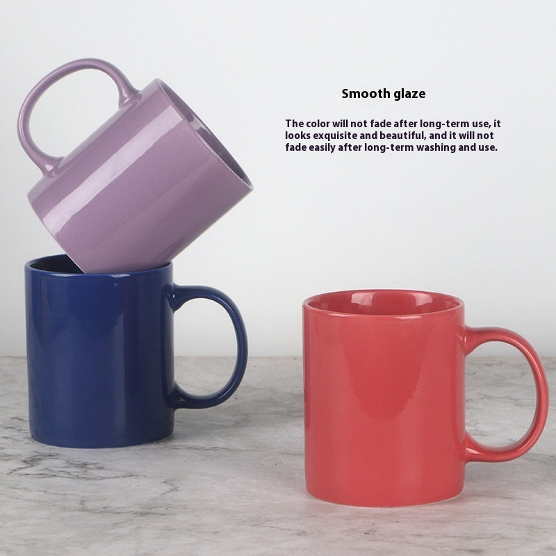 Side view of a modern bright ceramic coffee mug with a sleek microwave safe design